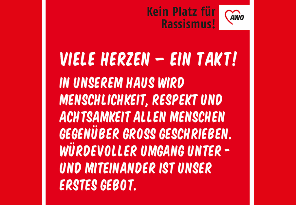 Ein rotes Poster mit dem AWO-Logo und einem Text &uuml;ber Menschlichkeit und Respekt.
