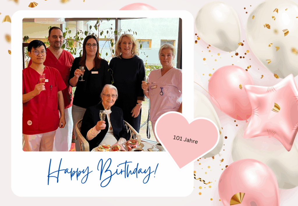 Eine Gruppe von Menschen feiert den 101. Geburtstag einer älteren Frau.