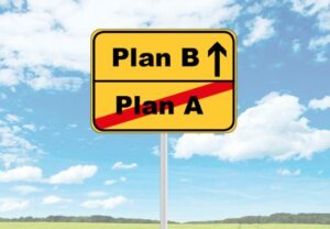 Verkehrsschild mit 'Plan B' und 'Plan A' durchgestrichen