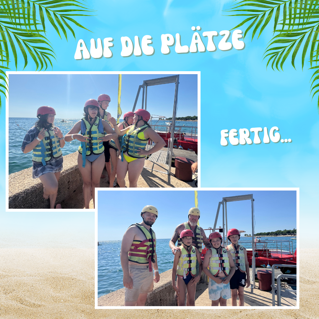 Gruppe von Menschen mit Schwimmwesten und Helmen am Steg.